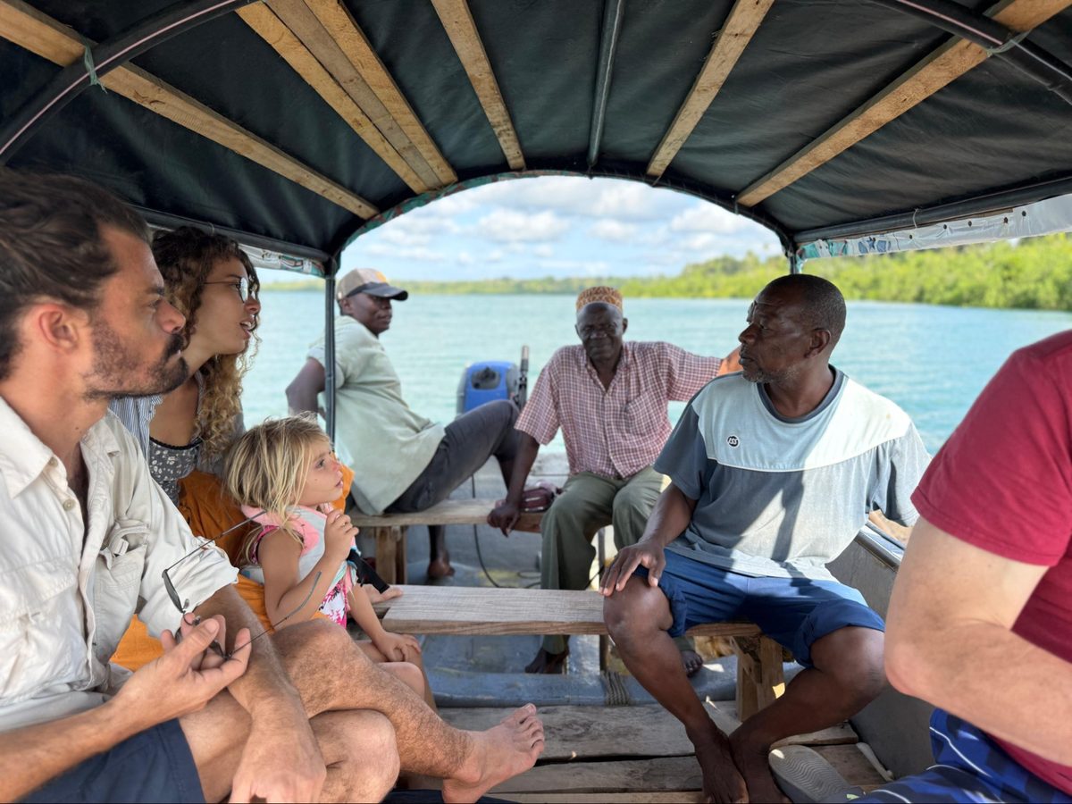 Asili Company team consulting with Zanzibar fishing community on boat