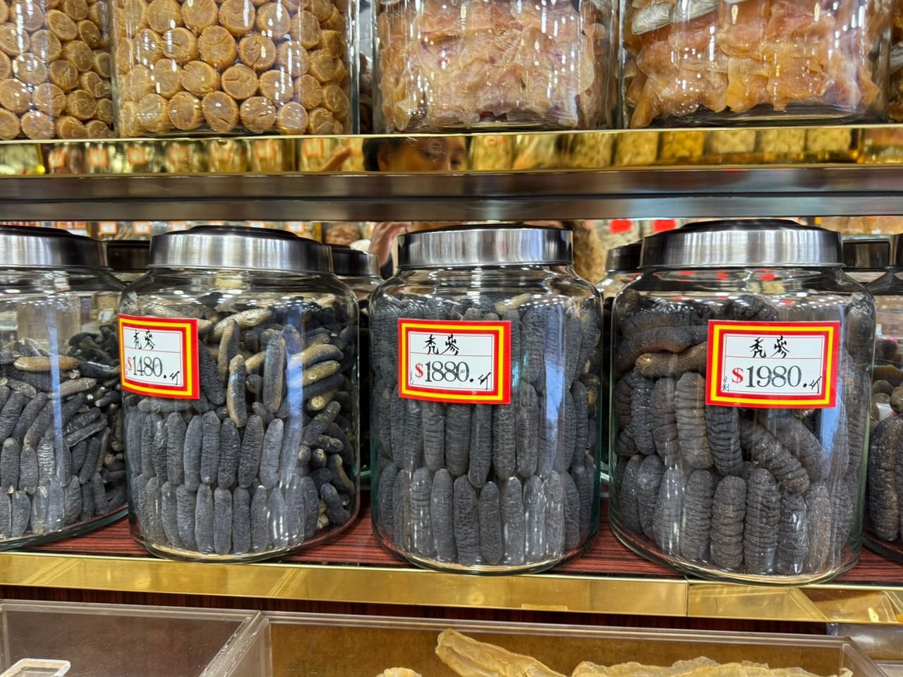 Jars of dried sea cucumber, bêche-de-mer, on sale in a dried seafood shop